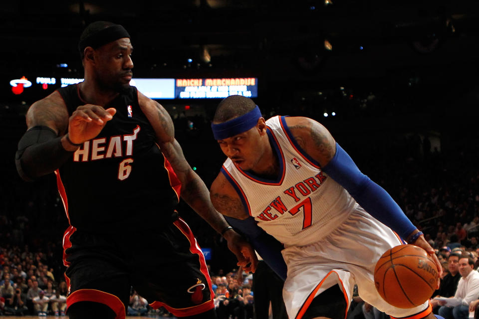 NEW YORK, NY - MAY 06: Carmelo Anthony #7 of the New York Knicks drives against LeBron James #6 of the Miami Heat in the first quarter of Game Four of the Eastern Conference Quarterfinals in the 2012 NBA Playoffs on May 6, 2012 at Madison Square Garden in New York City. NOTE TO USER: User expressly acknowledges and agrees that, by downloading and or using this photograph, User is consenting to the terms and conditions of the Getty Images License Agreement (Photo by Jeff Zelevansky/Getty Images)