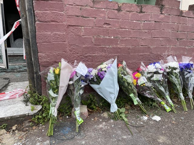 Flowers at the scene in Napier Road, East Ham