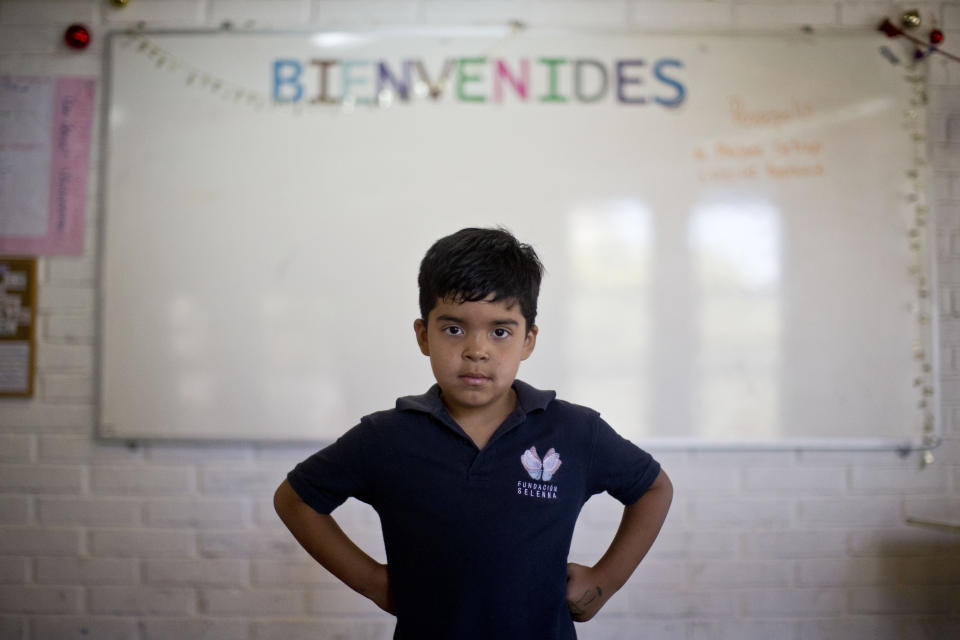 In this Dec.12, 2018 photo, Alexis, a transgender boy, poses for a photo at the Amaranta Gomez school in Santiago, Chile. "I'm happy here because there are many other kids just like me," said Alexis, who also said that he was constantly bullied at his previous school. (AP Photo/Esteban Felix)