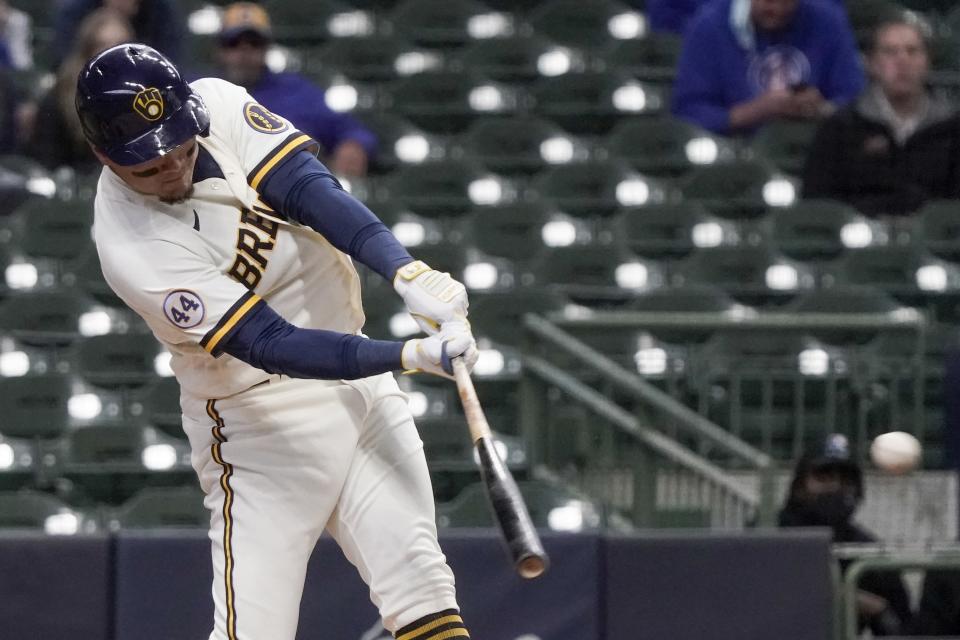 Milwaukee Brewers' Avisail Garcia hits a double during the first inning of a baseball game against the Chicago Cubs Wednesday, April 14, 2021, in Milwaukee. (AP Photo/Morry Gash)