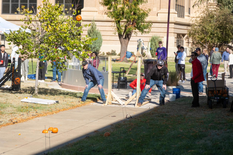 The Brothers team launches their winning gourd Thursday at WT's annual "Pumkin Chunkin" contest on its Canyon campus.