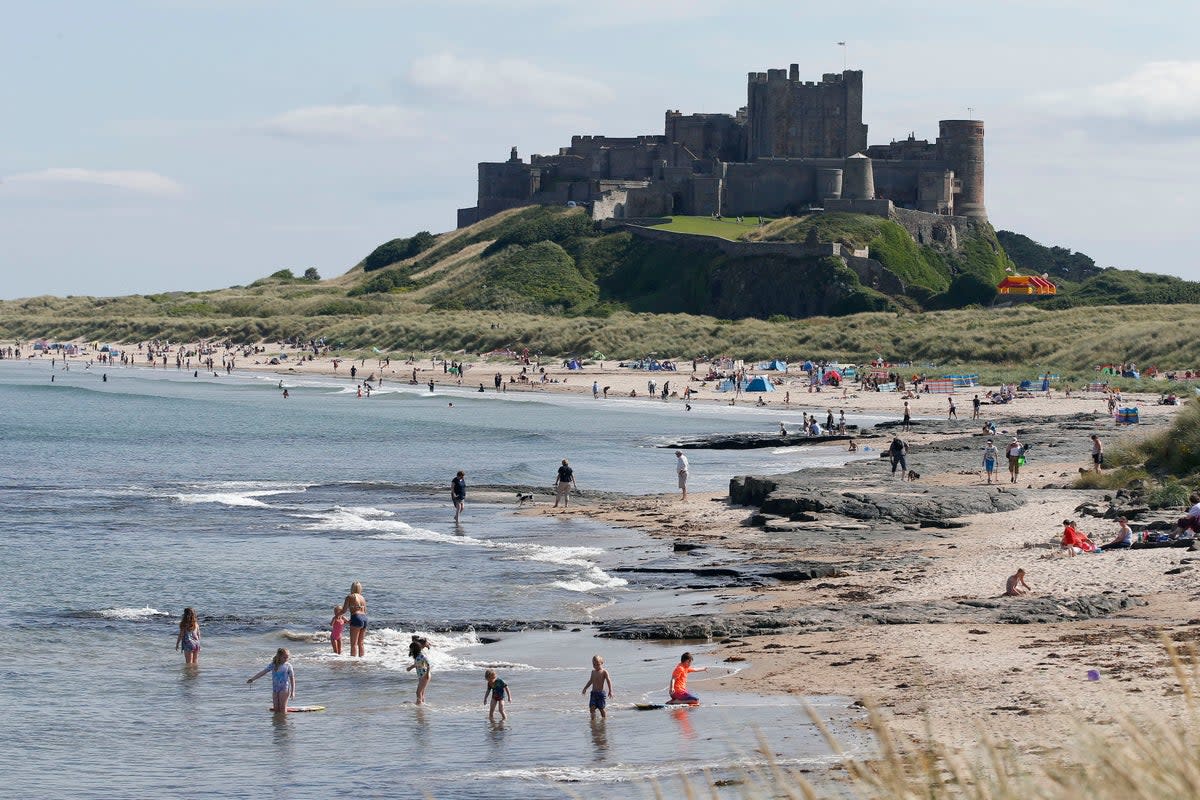 A view of Bamburgh Castle and the beach  (PA Archive)