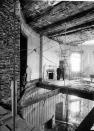 Two unidentified men stand in what remains of the second-floor Oval Study above the Blue Room. The north wall and part of the floor have been removed for the installation of steel shoring columns. <a href="http://www.flickr.com/photos/usnationalarchives/page3/" rel="nofollow noopener" target="_blank" data-ylk="slk:(Photo courtesy of the National Archives);elm:context_link;itc:0;sec:content-canvas" class="link ">(Photo courtesy of the National Archives)</a>