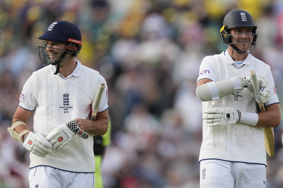 England's James Anderson, left, and England's Stuart Broad, right, leaves the pitch at the end of play on day three of the fifth Ashes Test match between England and Australia, at The Oval cricket ground in London, Saturday, July 29, 2023. (AP Photo/Kirsty Wigglesworth)