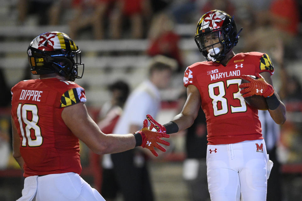 Maryland wide receiver Carlos Carriere (83) celebrates his touchdown with tight end CJ Dippre (18) during the second half of an NCAA college football game against Howard, Saturday, Sept. 11, 2021, in College Park, Md. (AP Photo/Nick Wass)