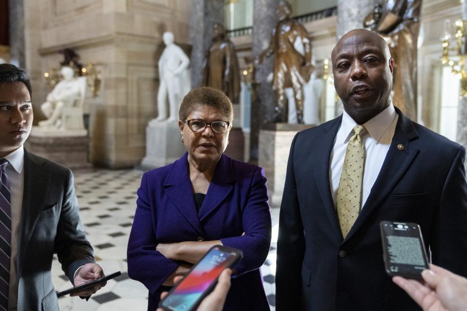 Rep. Karen Bass, D-Calif., and Sen. Tim Scott, R-S.C., speak briefly to reporters following a meeting about police reform legislation on Capitol Hill May 18, 2021, in Washington, D.C. <a href="https://www.gettyimages.com/detail/news-photo/rep-karen-bass-and-sen-tim-scott-speak-briefly-to-reporters-news-photo/1232964913?adppopup=true" rel="nofollow noopener" target="_blank" data-ylk="slk:Drew Angerer/Getty Images;elm:context_link;itc:0;sec:content-canvas" class="link ">Drew Angerer/Getty Images</a>