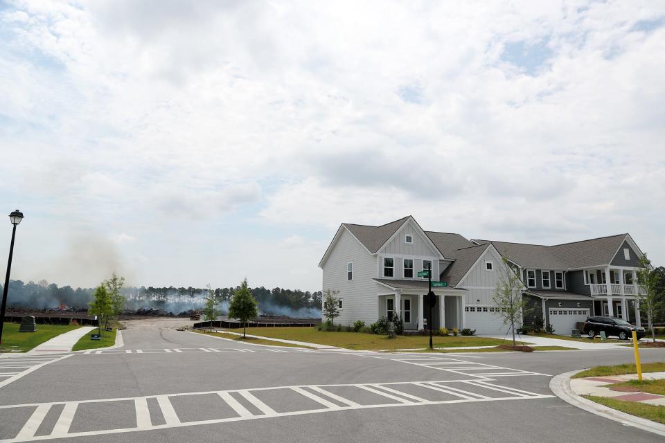 More land is being cleared for future development behind completed homes in Heartwood at Richmond Hill.