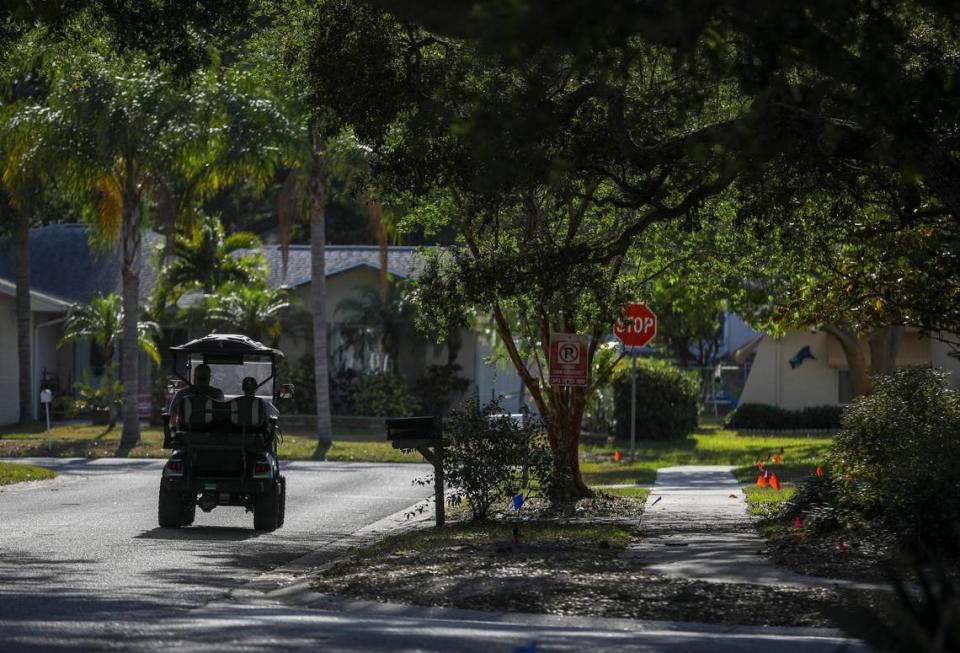 A golf cart is seen along Teakwood Lane near the home Florida Gov. Ron DeSantis grew up in Thursday, April 20, 2023 in Dunedin.