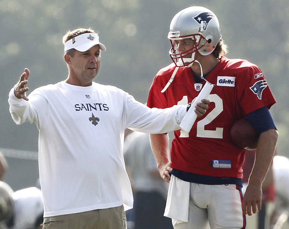 New Orleans Saints head coach Sean Payton chats with then-New England Patriots quarterback Tom Brady during a joint practice in 2010. (AP Photo/Winslow Townson)