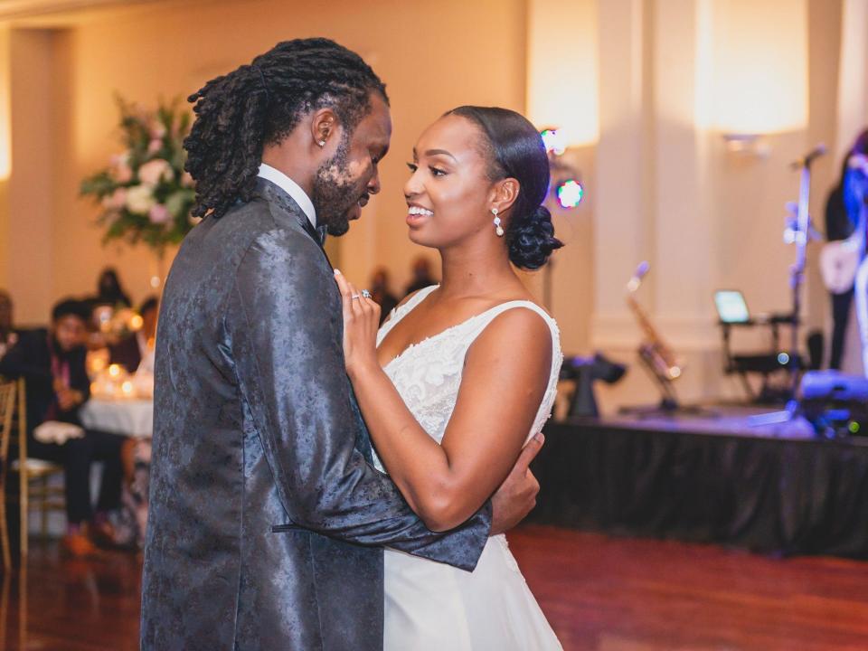 A bride and groom dance during their wedding reception.