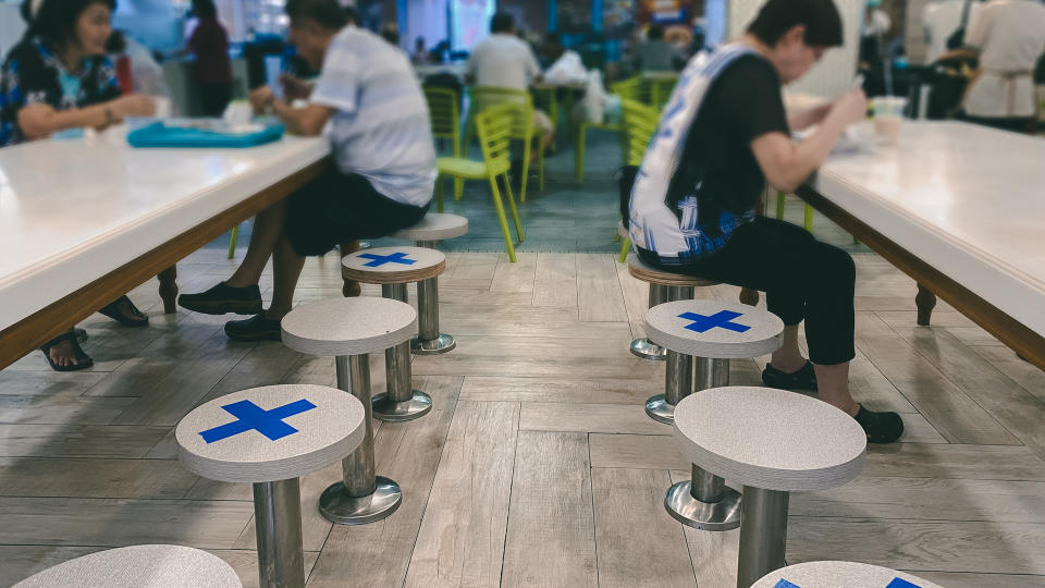 Singapore Mar2020 Social distancing rules in practice, alternate seating in local public food courts (restaurants, food outlets), to reduce risk of further transmission; safety measures.