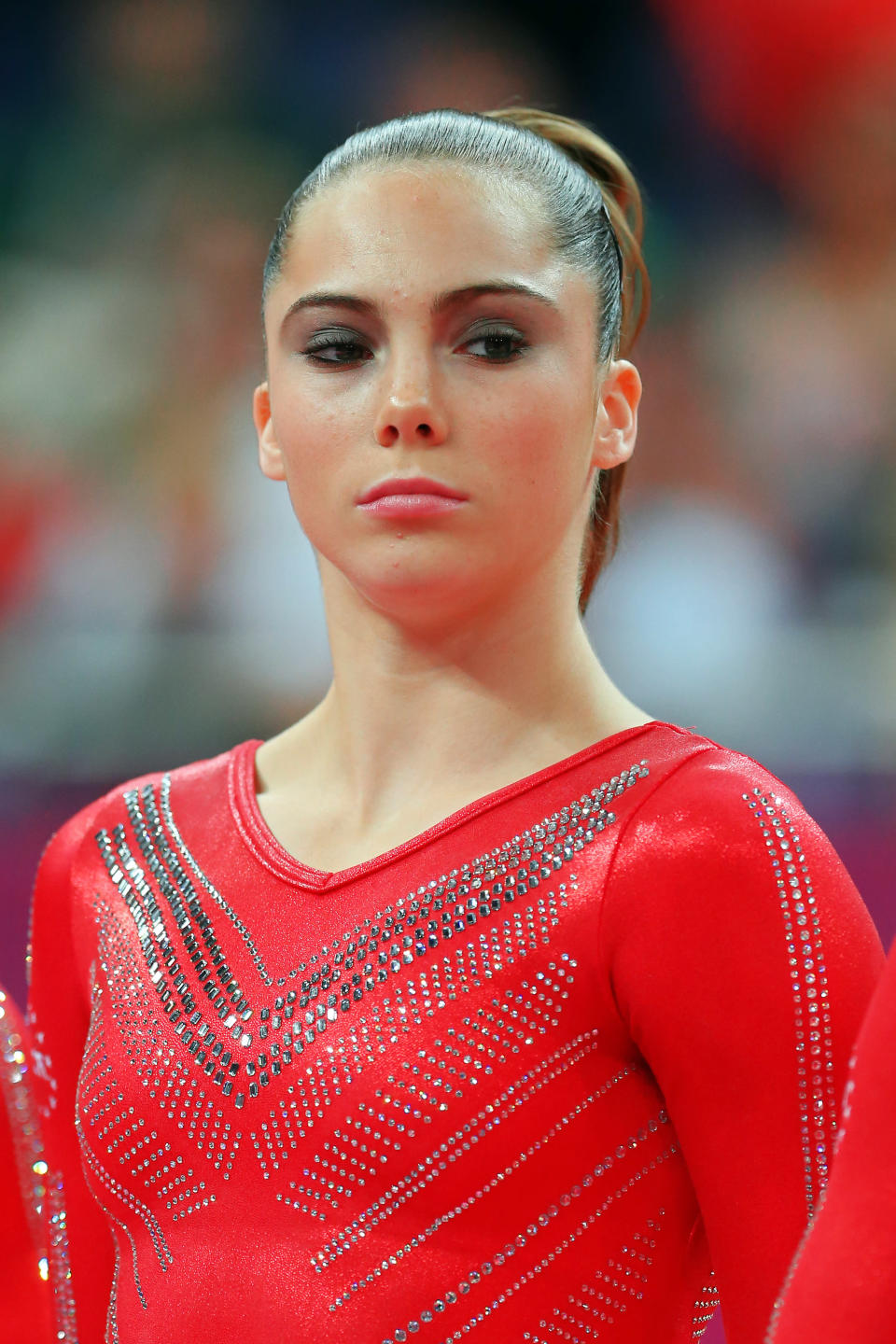 LONDON, ENGLAND - JULY 31: Mc Kayla Maroney of the United States looks on as she is introduced in the Artistic Gymnastics Women's Team final on Day 4 of the London 2012 Olympic Games at North Greenwich Arena on July 31, 2012 in London, England. (Photo by Ronald Martinez/Getty Images)