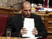 Greek Finance Minister Yanis Varoufakis holds his speech notes before a vote of confidence at the parliament in Athens February 10, 2015. REUTERS/Alkis Konstantinidis