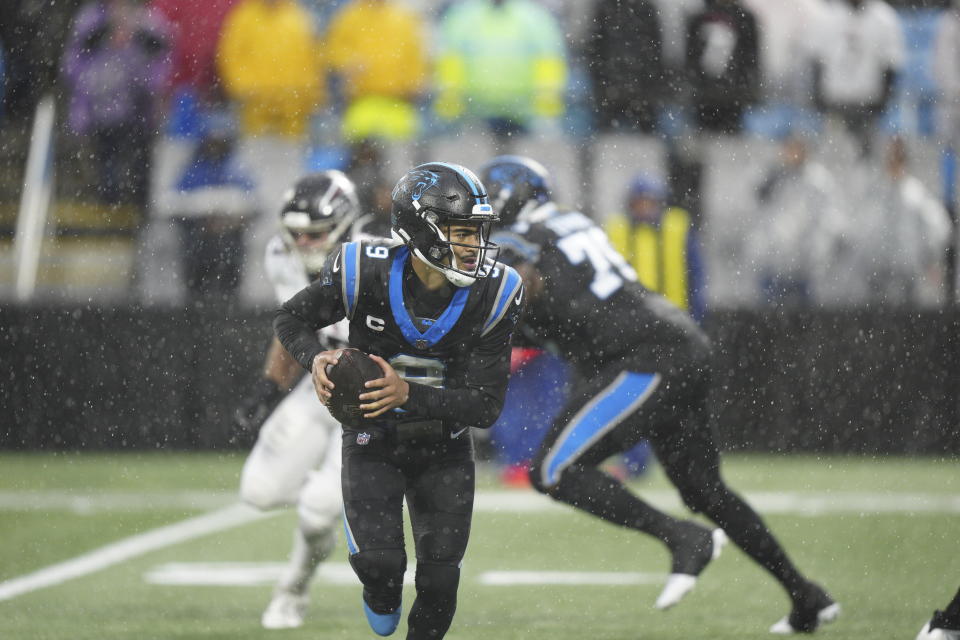 Carolina Panthers quarterback Bryce Young runs against the Atlanta Falcons during the first half of an NFL football game Sunday, Dec. 17, 2023, in Charlotte, N.C. (AP Photo/Jacob Kupferman)