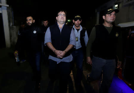 Former governor of Mexican state Veracruz Javier Duarte (C) is escorted by Guatemalan police after he was detained in a hotel in Panajachel, Guatemala 15 April 2017. REUTERS/Danilo Ramirez