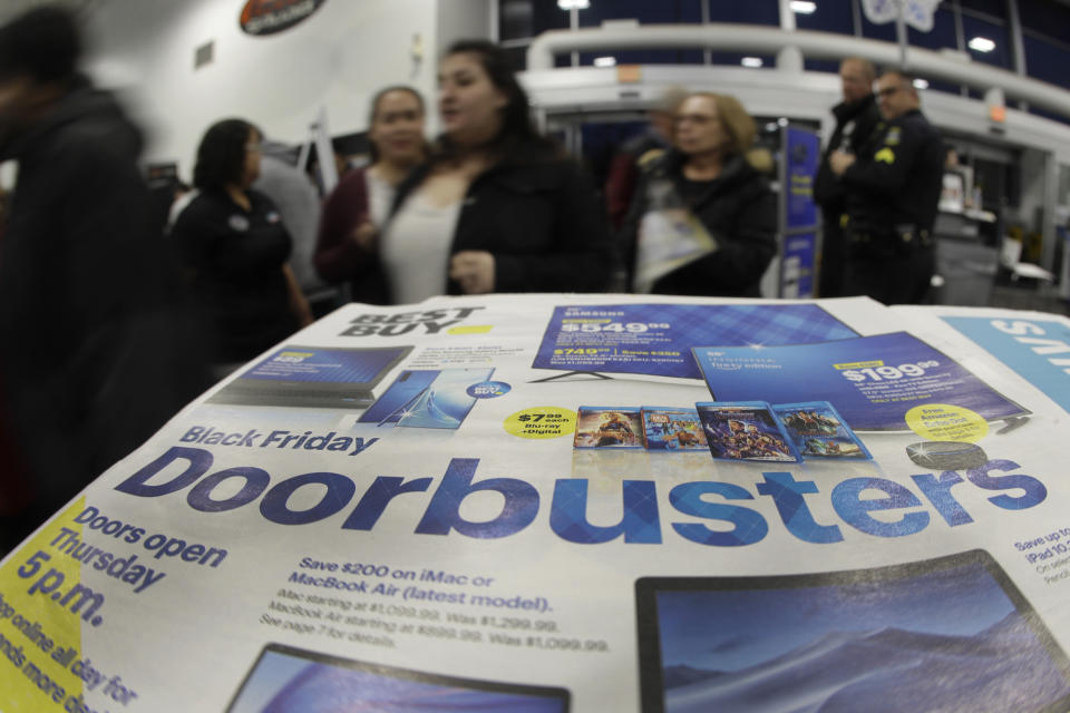 Shoppers enter a Best Buy store for a Black Friday sale Thursday, Nov. 28, 2019, in Overland Park, Kan. (AP Photo/Charlie Riedel)
