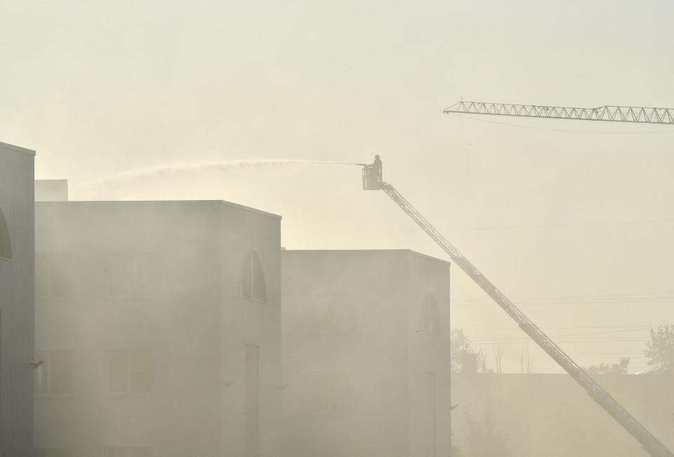 Rescuers put out a fire in an industrial facility after Russian drones targeted the Ukrainian capital of Kiyv on May 28, 2023.