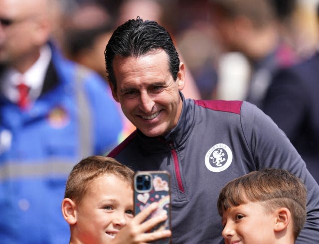 Aston Villa manager Unai Emery poses with fans prior to a pre-season friendly at Walsall