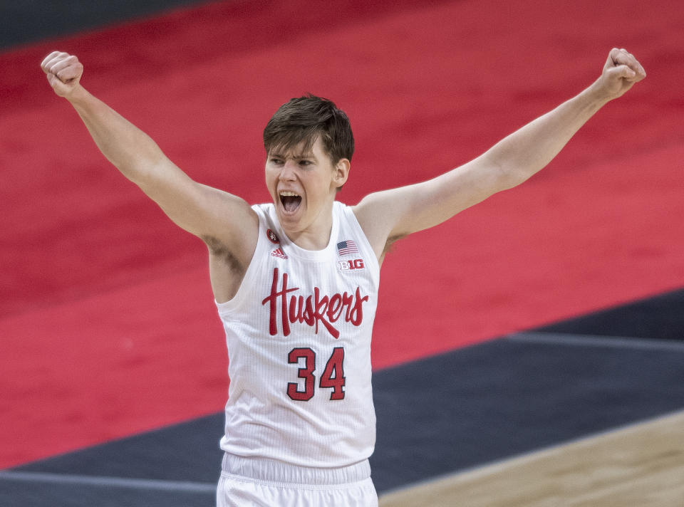 Nebraska guard Thorir Thorbjarnarson (34) celebrates a three-point basket by teammate Shamiel Stevenson (4) against Illinois during the first half of an NCAA college basketball game on Friday, Feb. 12, 2021, in Lincoln, Neb. (Francis Gardler/Lincoln Journal Star via AP)