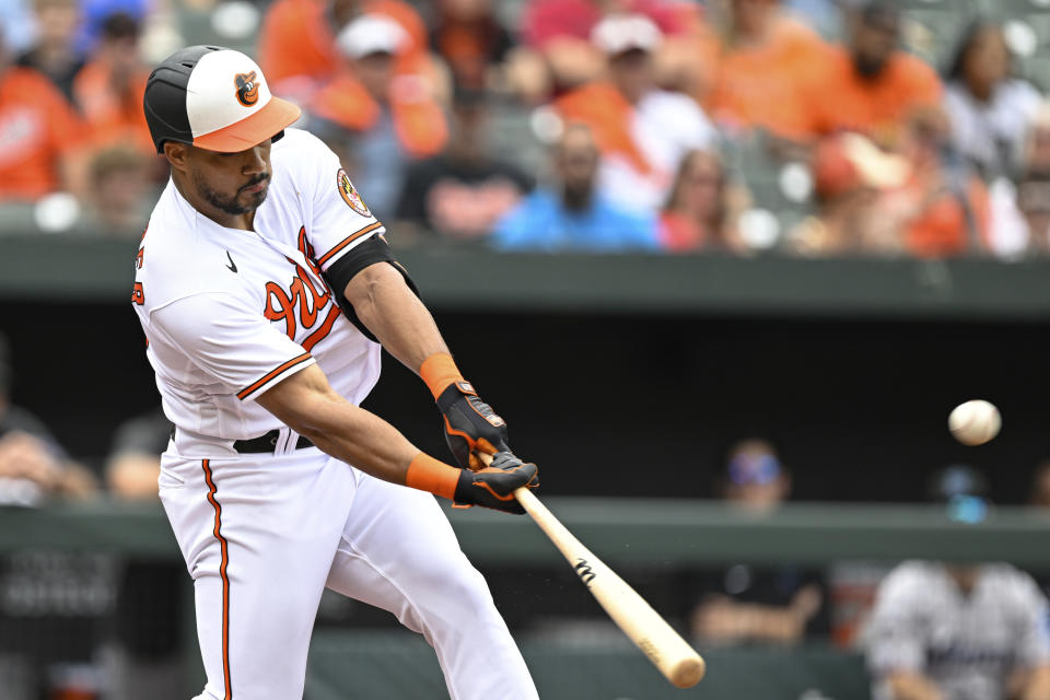 Baltimore Orioles' Anthony Santander hits a two-run home run against Miami Marlins relief pitcher Steven Okert which scored Adley Rutschman during the first inning of a baseball game, Sunday, July 16, 2023, in Baltimore. (AP Photo/Terrance Williams)