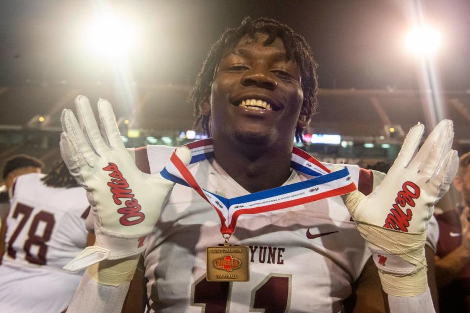 Picayune’s Jamonta Waller shows off his medal after winning the 5A State Championship at M.M. Roberts Stadium in Hattiesburg on Friday, Dec. 2, 2022.