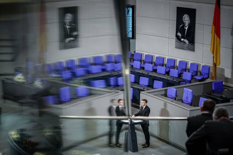 Emmanuel Macron, President of France, speaks at the memorial service for the deceased former President of the Bundestag Wolfgang Schaeuble in the plenary chamber of the German Bundestag. Kay Nietfeld/dpa