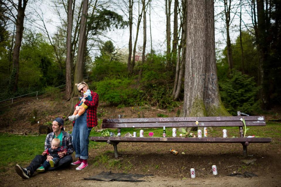 With the whole family decked out in plaid shirts and Converse All Star shoes, mother Natalie Sullivan, holding daughter Frieda, and father Tyler Sullivan, holding son Varga, paid homage to the late rock icon of Nirvana's lead singer, Kurt Cobain, near the home where Cobain died on the 20th anniversary of his death, Saturday, April 5, 2014, at Viretta Park in Seattle, Wash. On April 10, Nirvana will be inducted into the Rock and Roll Hall of Fame. (AP Photo/seattlepi.com, Jordan Stead) STAND ALONE PHOTO. MAGS OUT; NO SALES; SEATTLE TIMES OUT; MANDATORY CREDIT; TV OUT