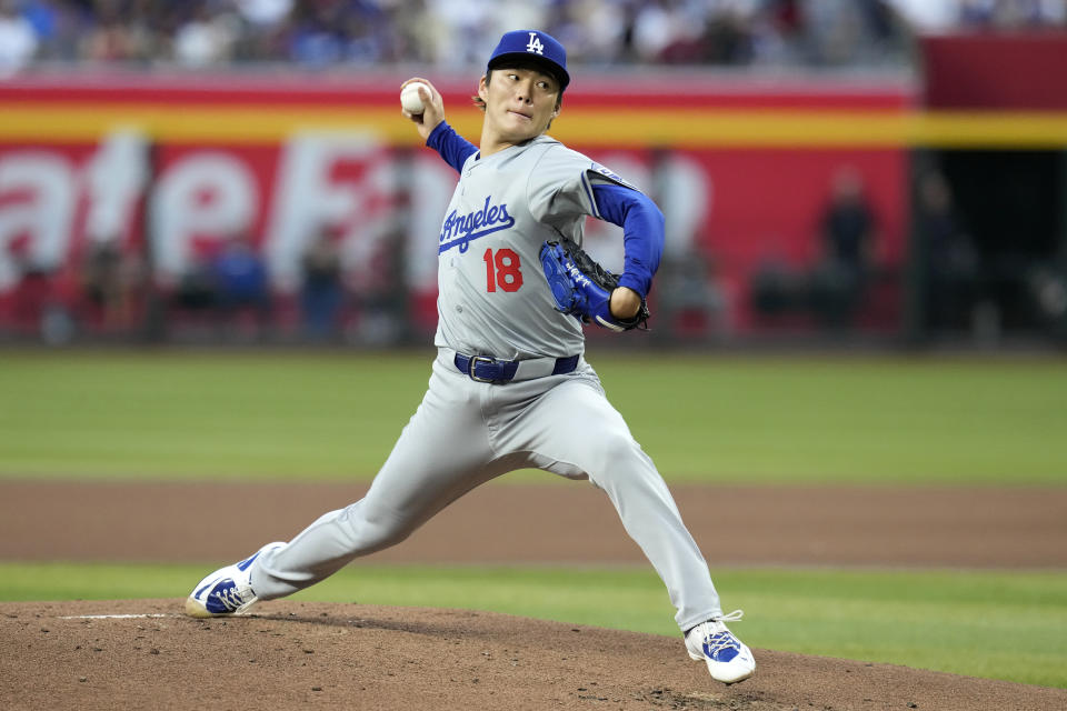 Los Angeles Dodgers starting pitcher Yoshinobu Yamamoto, of Japan, throws against the Arizona Diamondbacks during the first inning of a baseball game Wednesday, May 1, 2024, in Phoenix. (AP Photo/Ross D. Franklin)