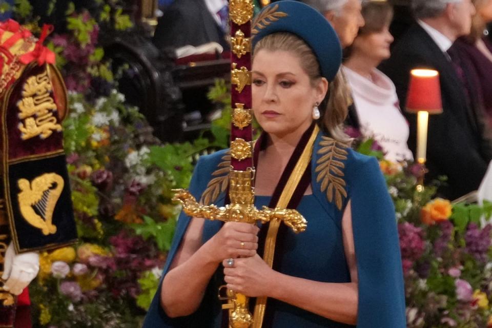Penny Mordaunt carrying the sword of state at the coronation of King Charles III in May 2023 (PA)