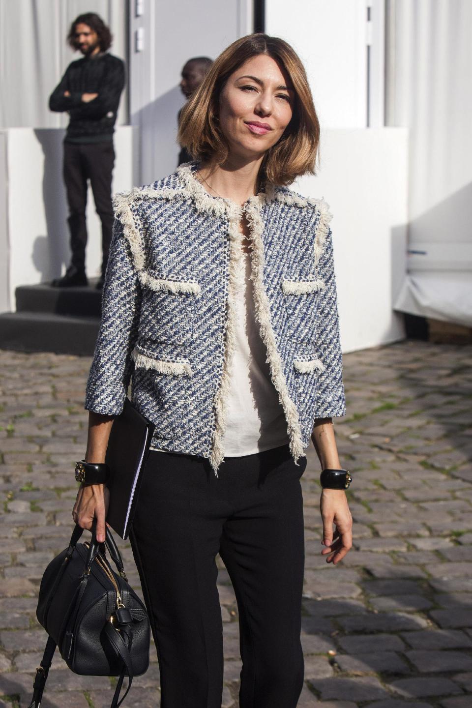 Sofia Coppola leaves after attending the presentation of Vuitton's ready-to-wear Spring/Summer 2014 fashion collection, presented Wednesday, Oct. 2, 2013 in Paris. (AP Photo/Thibault Camus)