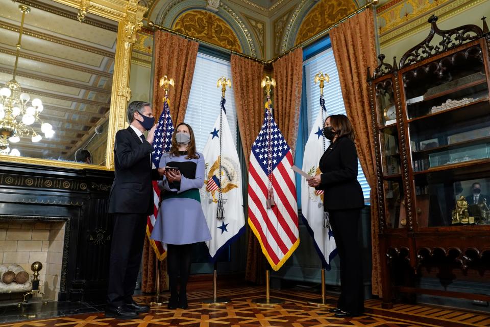 A photo of Antony Blinken being sworn in as Secretary of State by Kamala Harris.