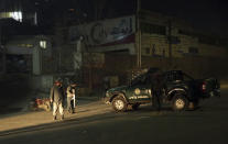 <p>Policemen block the main road near the Intercontinental Hotel after a deadly attack in Kabul, Afghanistan, Jan. 20, 2018. (Photo: Massoud Hossaini/AP) </p>