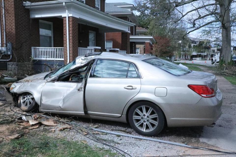 A damaged car sits in a driveway in the Chevy Chase neighborhood in Lexington on April 3, 2024. Tasha Poullard/tpoullard@herald-leader.com