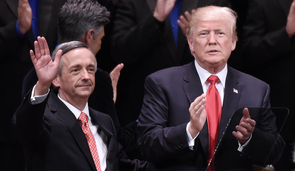 Pastor Robert Jeffress waves next to President Donald Trump at an event at the Kennedy Center in Washington, D.C., on July 1, 2017.
