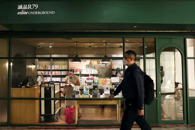 FILE PHOTO: Man walks past a bookstore in an underground shopping centre in Taipei