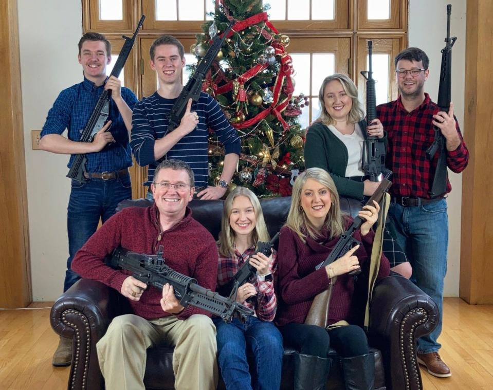 U.S. Rep. Thomas Massie, R-Kentucky, poses with his family and their guns for a Christmas greeting that was tweeted days after the school shooting in Oxford, Michigan, setting off a storm of reaction.