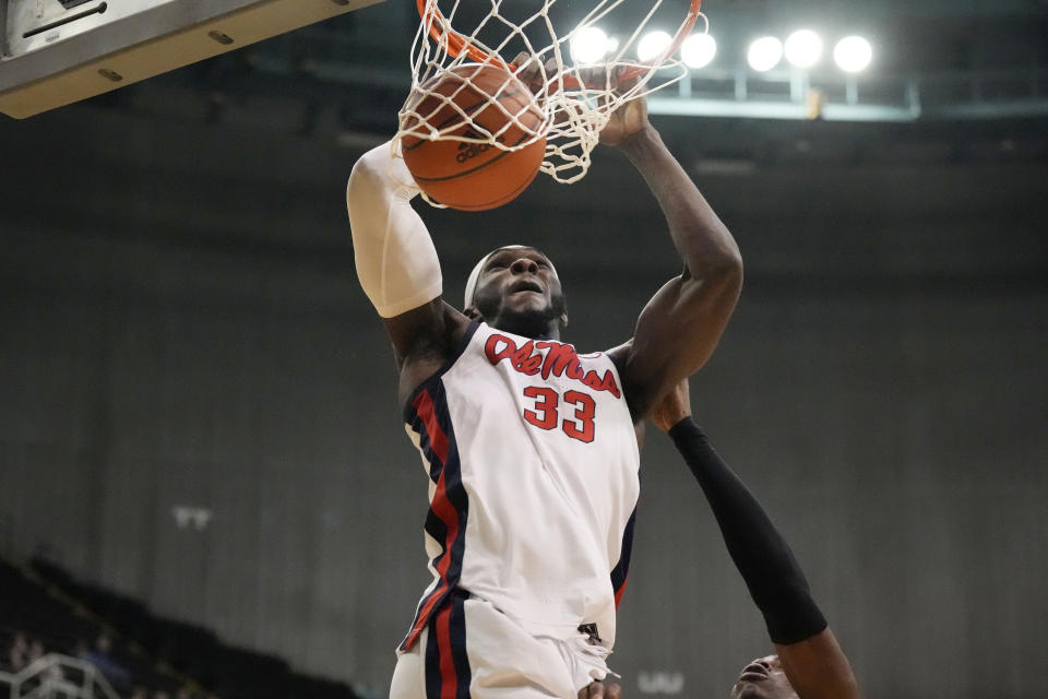 Mississippi forward Moussa Cisse (33) dunks during the first half of an NCAA college basketball game against Southern Mississippi, Saturday, Dec. 23, 2023, in Biloxi, Miss. (AP Photo/Rogelio V. Solis)