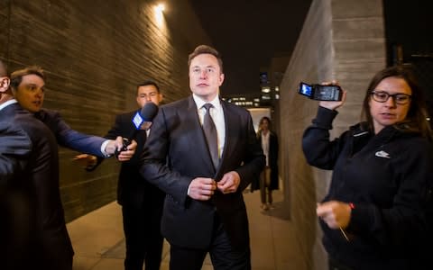 Elon Musk, chief executive officer of Tesla Inc. leaves the US District Court through a back door  - Credit: Getty Images North America/Apu Gomes