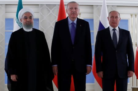 Presidents Rouhani of Iran, Erdogan of Turkey and Putin of Russia pose before their meeting in Ankara