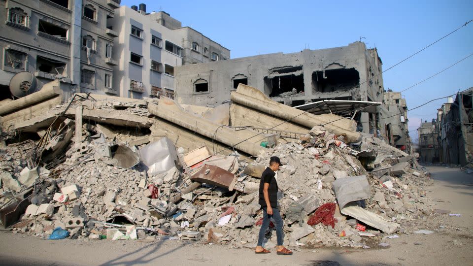 Palestinian residents inspect damage to their homes caused by Israeli airstrikes on October 14, 2023. Many Gazan citizens have fled to the south following evacuation warnings from the Israeli government. - Ahmad Hasaballah/Getty Images