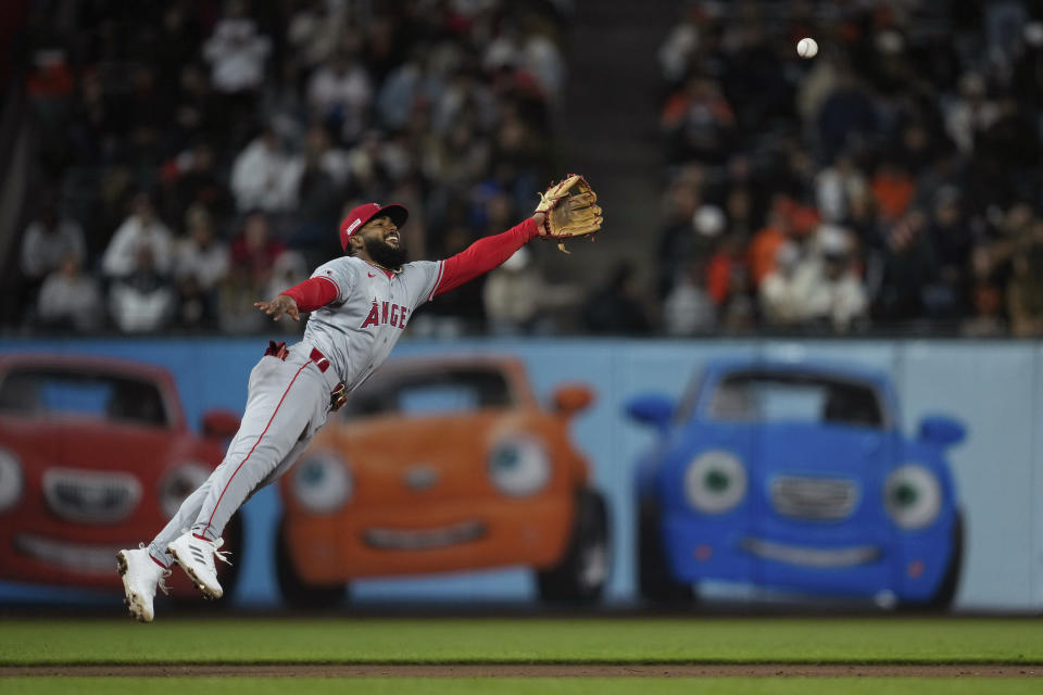 Los Angeles Angels third baseman Luis Rengifo is unable to catch a single hit by San Francisco Giants' Nick Ahmed during the eighth inning of a baseball game Friday, June 14, 2024, in San Francisco. (AP Photo/Godofredo A. Vásquez)