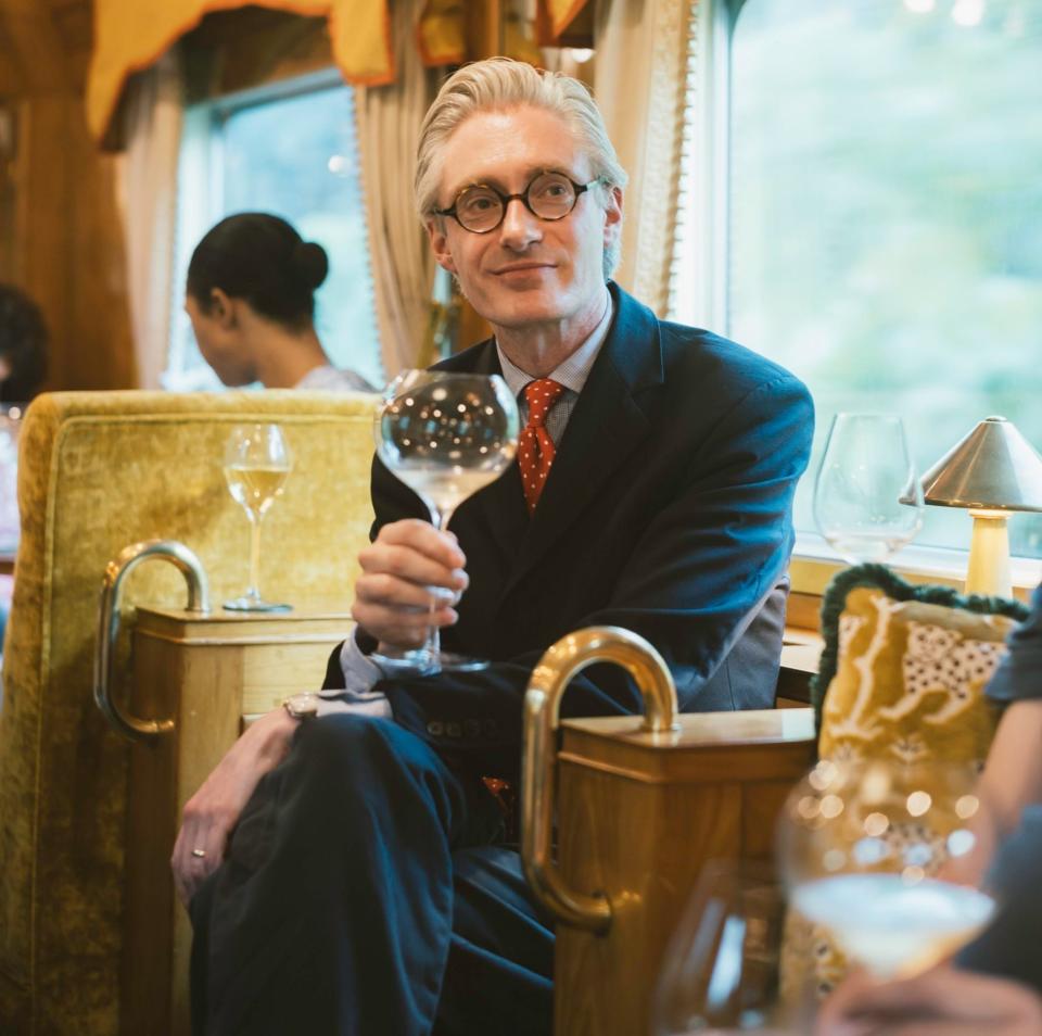 Steven King tastes wine aboard the Eastern & Oriental Express