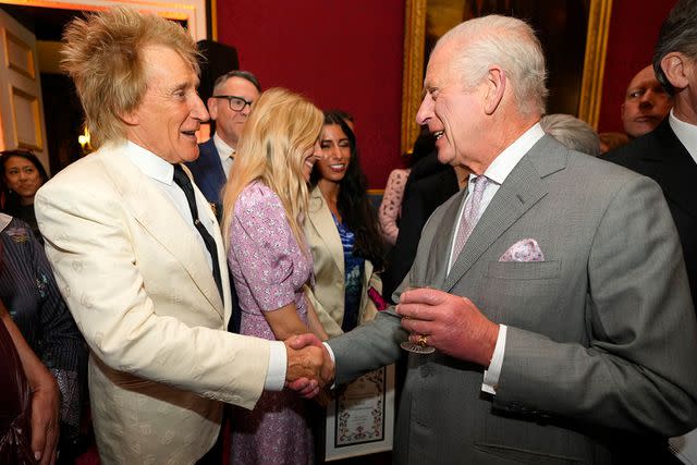 <p>KIRSTY WIGGLESWORTH/POOL/AFP via Getty</p> Rod Stewart and King Charles speak at the inaugural King's Foundation Awards at St James' Palace on June 11, 2024.