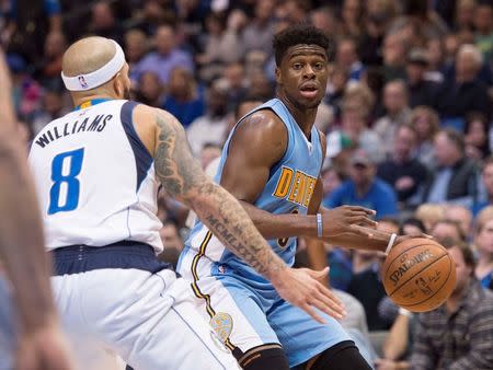 Nov 28, 2015; Dallas, TX, USA; Dallas Mavericks guard Deron Williams (8) defends against Denver Nuggets guard Emmanuel Mudiay (0) during the second half at the American Airlines Center. The Mavericks defeat the Nuggets 92-81. Mandatory Credit: Jerome Miron-USA TODAY Sports