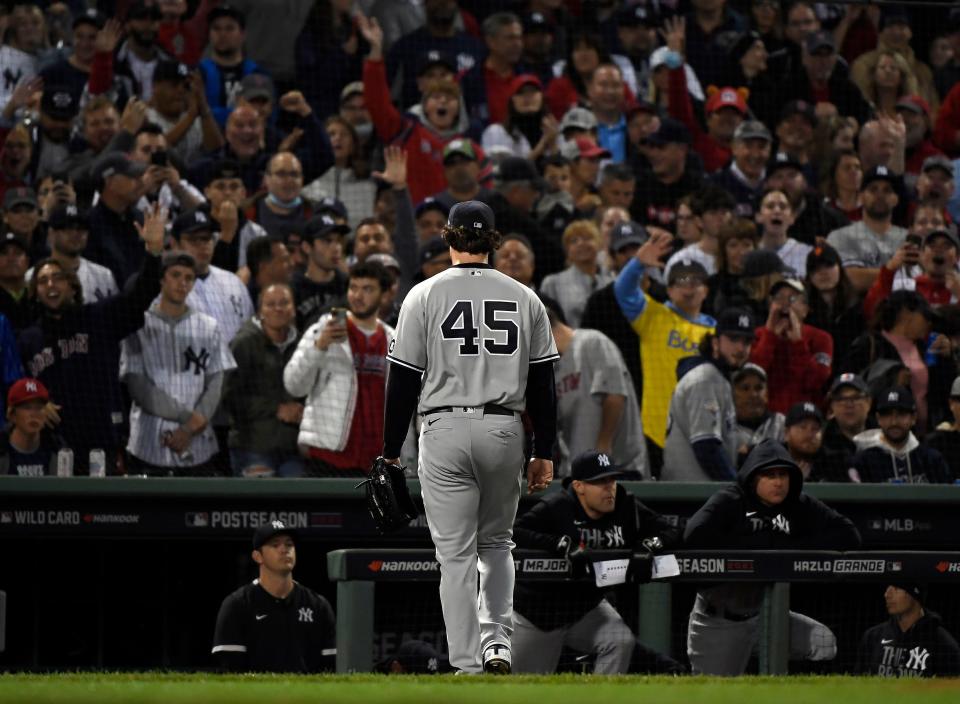 Yankees starting pitcher Gerrit Cole walks to the dugout after being pulled against the Red Sox during the third inning of the American League wild-card game at Fenway Park in Boston on Oct. 5, 2021.