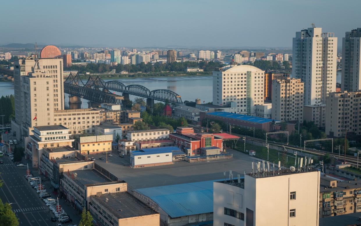 China has set up machines in the city of Dandong, on the border with North Korea, to check for droplets of Covid-19 in the air - Yan Cong