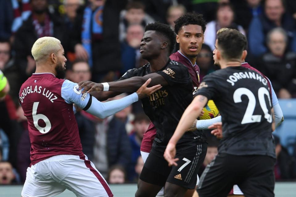 Douglas Luiz tried, and failed, to get in Bukayo Saka’s face (Arsenal FC via Getty Images)