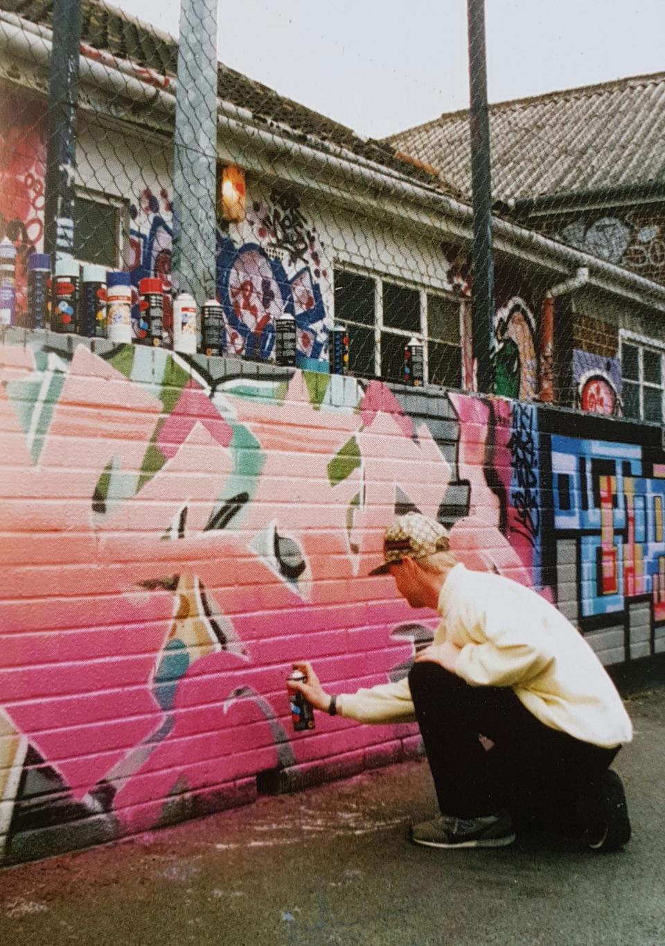 John Nation founded the project as a way to channel young people's creativity in a positive and legal way. Here he is pictured painting at the center in the late 80s. (John Nation)