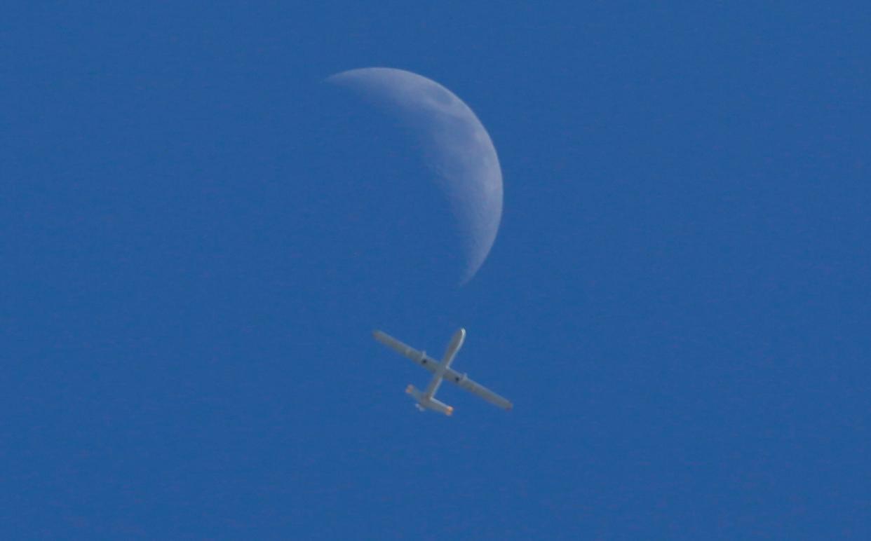 An Israeli drone flies over Gaza City on Monday, May 17, 2021. The Israeli military unleashed a wave of heavy airstrikes Monday on the Gaza Strip, saying it destroyed 15 kilometers (9 miles) of militant tunnels and the homes of nine Hamas commanders as international diplomats worked to end the weeklong war that has killed hundreds of people.