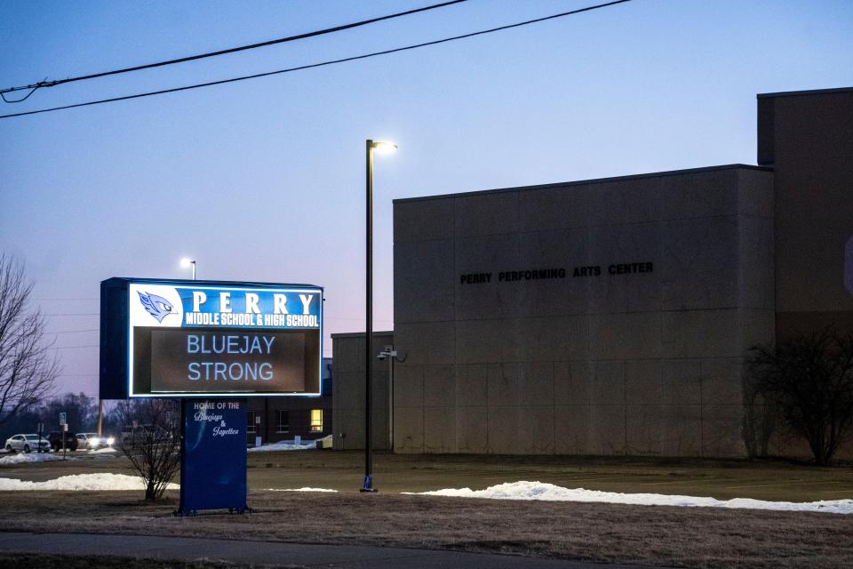 The Perry High School sign reads "Bluejay Strong" on Wednesday, Jan. 31, 2024, as the sun comes up on the first day of classes at the high school after the Jan. 4 shooting there.